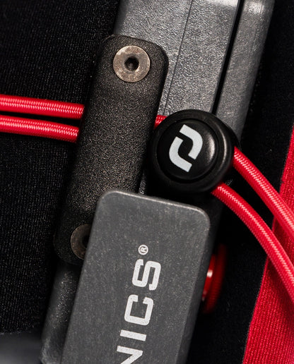Close-up of a device with red cables and 'SINICS' branding on a black background